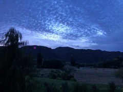 Sunrises over the hill, with the strange addition of the neon clock