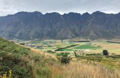 Pasture repurposed for skydiving with The Remarkables as backdrop
